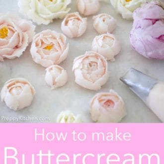 various buttercream flowers on a white marble counter