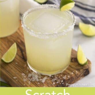 Pinterest graphic of a margarita recipe in a tumbler with a salt rim garnished with lime.