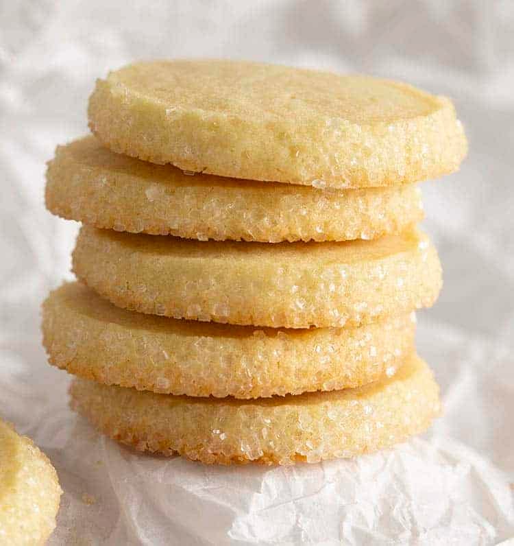 A stack of 5 butter cookies with sanding sugar on the edge