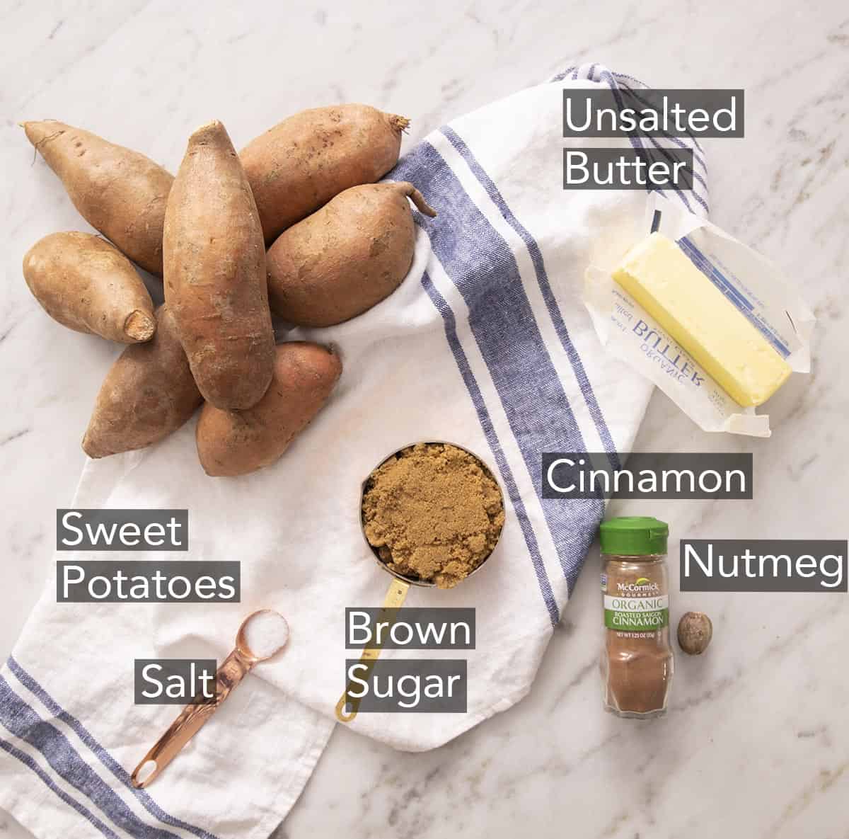 Ingredients for making candied yams on a marble counter.