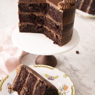 chocolate zucchini cake on a cake stand