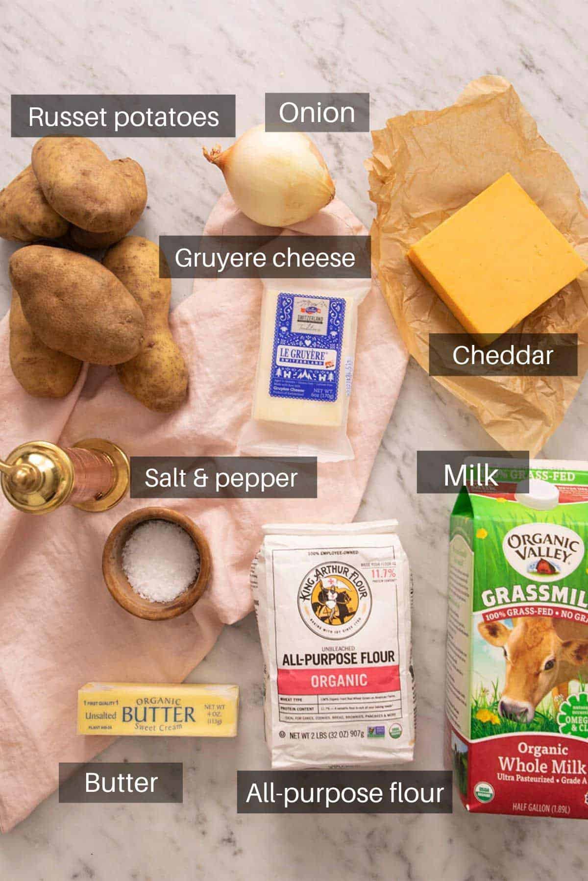 An overhead shot of all the ingredients you need to make potatoes au gratin