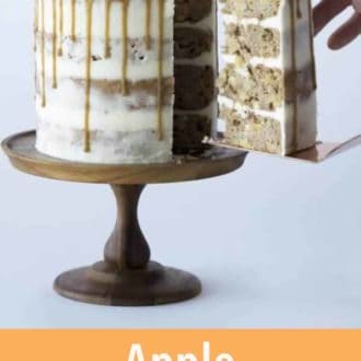 Pinterest graphic of a slice of apple spice cake being lifted from the rest of the cake.
