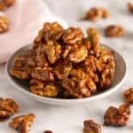 A bowl of candied walnuts.