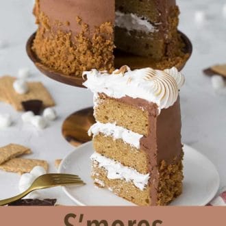 Pinterest graphic of a slice of s'mores cake on a plate in front of the cake.