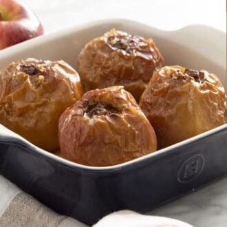 Pinterest graphic of four baked apples in a blue baking dish.
