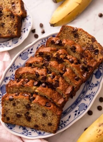 Slices of chocolate chip banana bread on a blue serving plate
