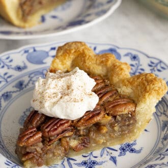 Pinterest graphic of a piece of pecan pie topped with a dollop of whipped cream.