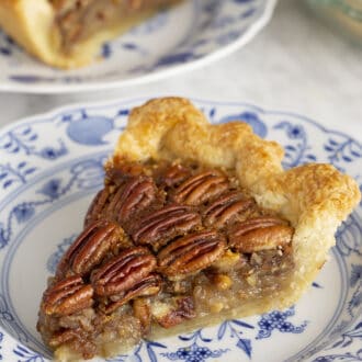 Pinterest graphic of a slice of homemade pecan pie with a butter crust.