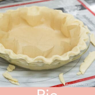 A pie crust wiith parchment paper inside.