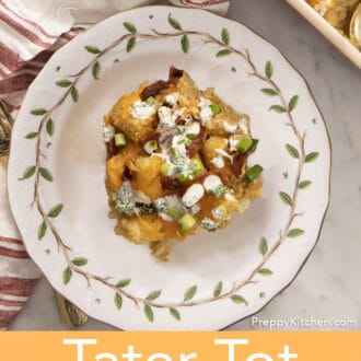 Tater tot casserol with bacon and cheddar cheese on a plate.