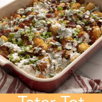 A red baking dish filled with tater tot casserole.