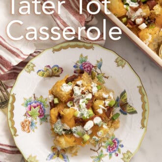 Tater tot casserole topped with homemade ranch on a plate.