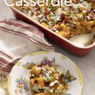 A Tater tot casserole served from a red baking dish.