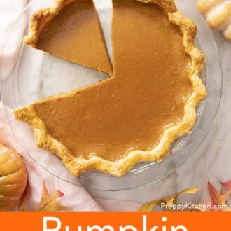 Pinterest graphic of a pumpkin pie in a glass pie dish with a few slices cut out.