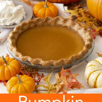 Pinterest graphic of a whole pumpkin pie with pumpkins and other fall decor surrounding it.