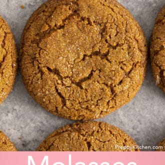 Pinterest graphic of an overhead view of a molasses cookies on a gray surface.