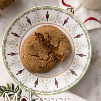 Pinterest graphic of a broken and whole molasses cookie on a holiday plate.