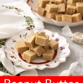 Pinterest graphic of peanut butter fudge pieces sitting on a holiday-themed plate. A platter in the background.