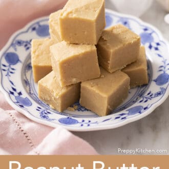 Pinterest graphic of a plate of peanut butter fudge pieces.