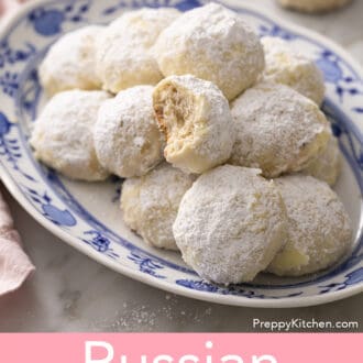 Pinterest graphic of Russian tea cakes on a blue and white platter.