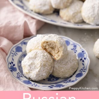 Pinterest graphic of Russian tea cakes on a blue and white plate.