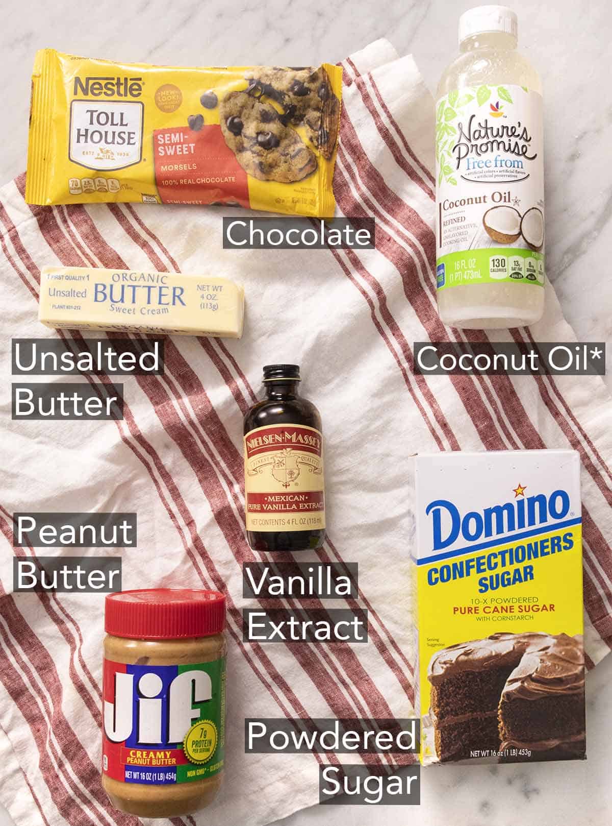 Ingredients needed to make buckeyes on a red and white napkin.