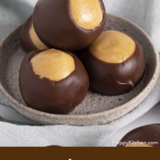 3 buckeyes stacked on a grey ceramic dish