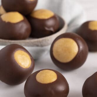 several buckeyes spread across a white marble counter