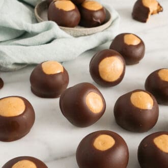 several buckeyes spread across a white marble counter