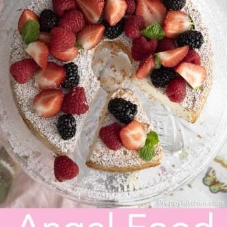 Pinterest graphic of an overhead view of an angel food cake on a glass cake stand topped with berries and mint.