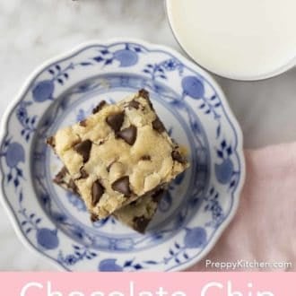 Pinterest graphic of an overhead shot of a stack of chocolate chip cookie bars on a plate next to a glass of milk.
