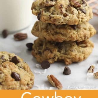 Pinterest graphic of a stack of cowboy cookies on parchment paper with a glass of milk in the background.