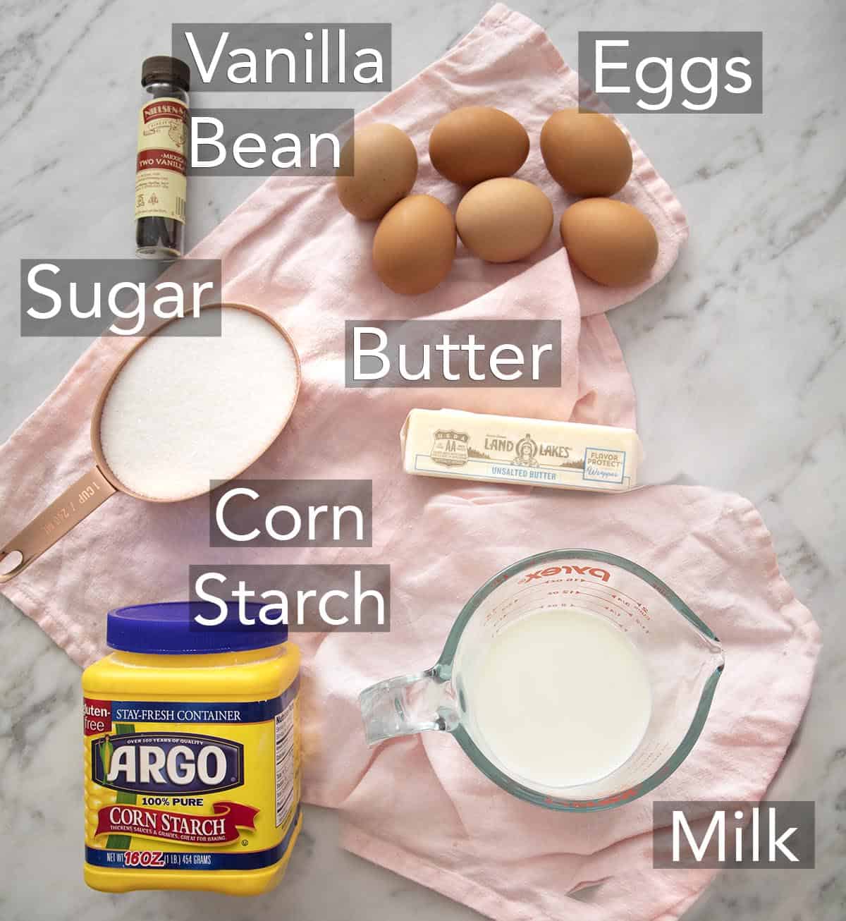 Ingredients for making pastry cream on a counter.