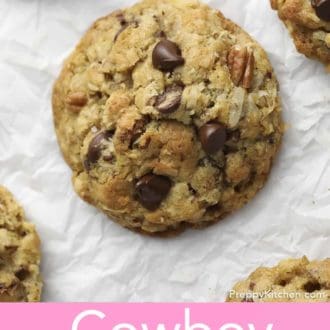 Pinterest graphic of cowboy cookies on parchment paper.