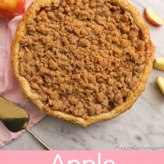 Pinterest graphic of an apple crumble pie on a marble counter.