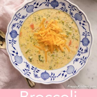Pinterest graphic of a broccoli cheese soup in a blue and white bowl.