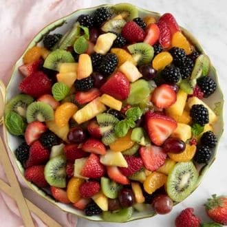 A large bowl filled with homemade fruit salad.