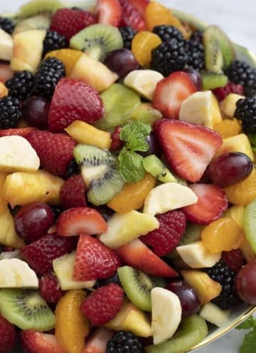 A large bowl filled with homemade fruit salad.