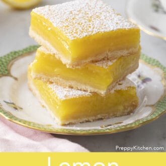 lemon bars stacked on a plate