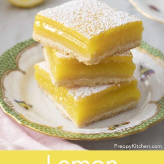 lemon bars stacked on a plate