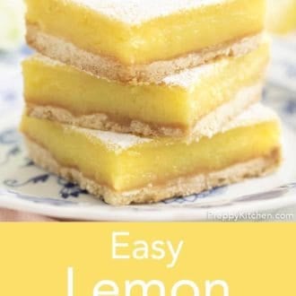 lemon bars stacked on a plate