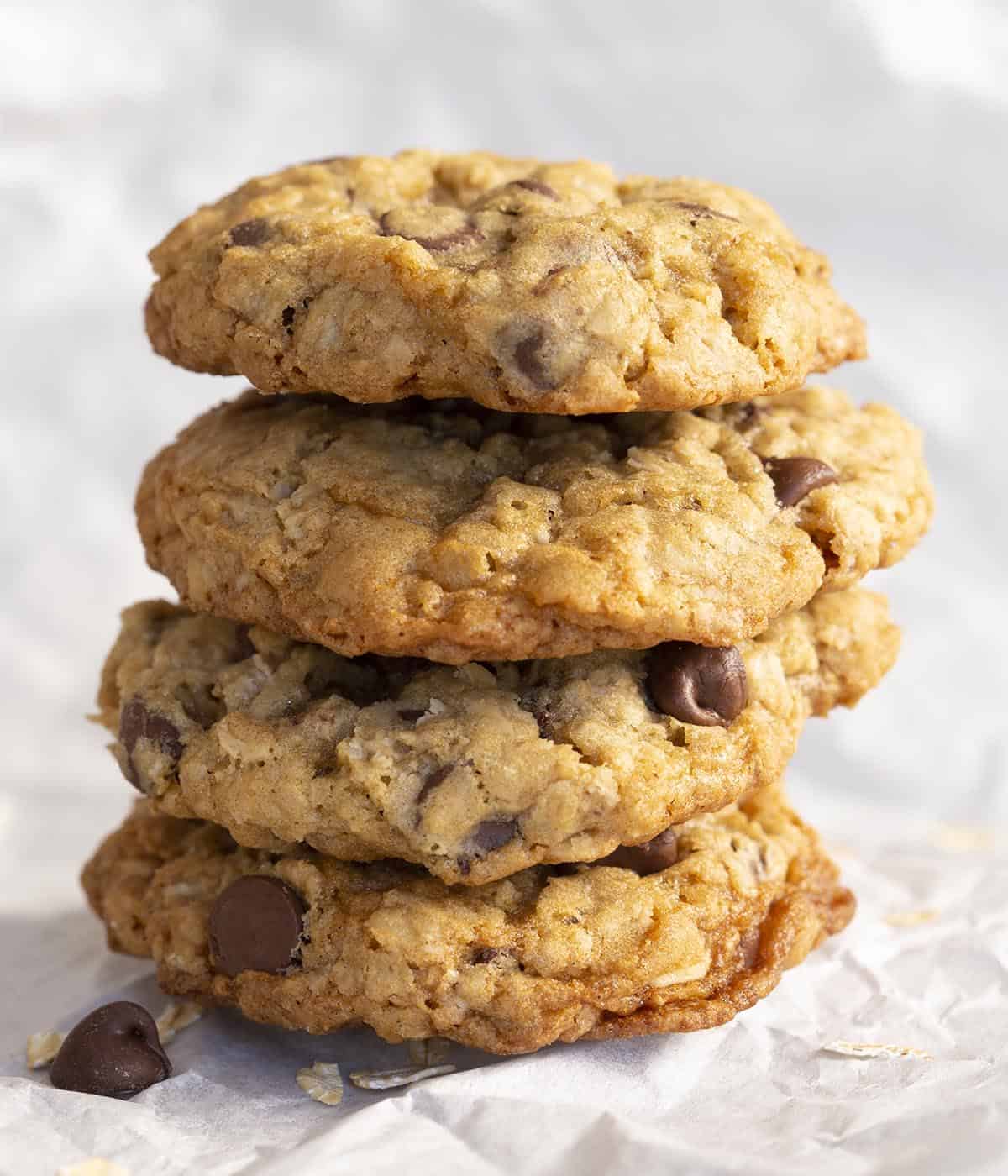 Four Oatmeal Chocolate Chip cookies stacked vertically.