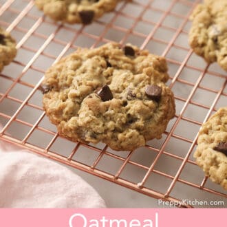 A group of Oatmeal Chocolate Chip Cookies on a copper cooling rack.