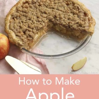 Pinterest graphic of apple crumble pie in a glass pie dish with a quarter cut out with apple slices scattered around.