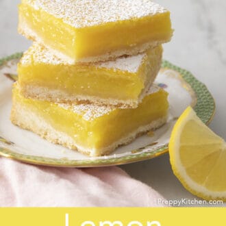lemon bars stacked on a plate