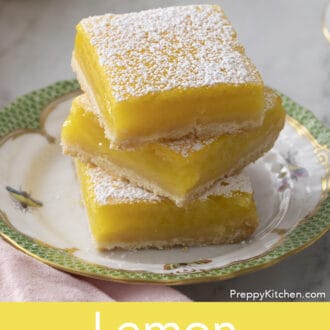 lemon bars stacked on a plate