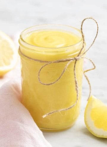 Lemon curd in a glass mason jar.