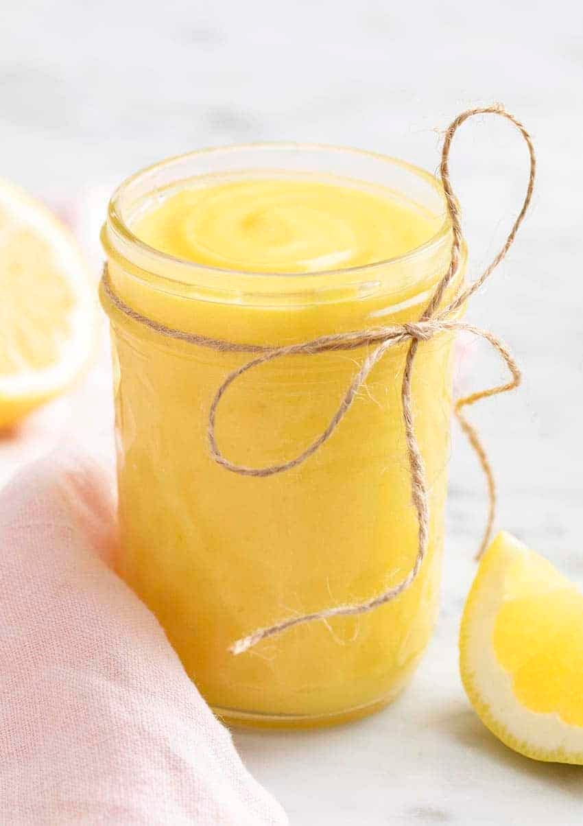 Lemon curd in a glass mason jar.