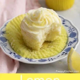 Pinterest graphic of lemon cupcake with lemon frosting on a plate with a bite taken out.